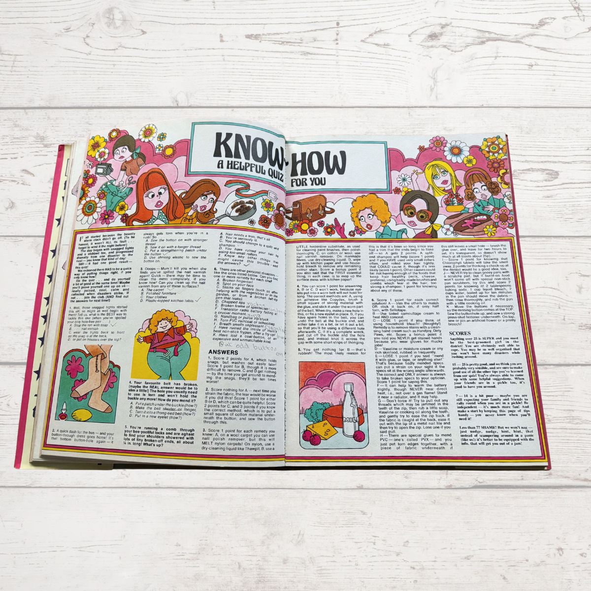 Vintage Diana annual 1976 open on a white wood background 