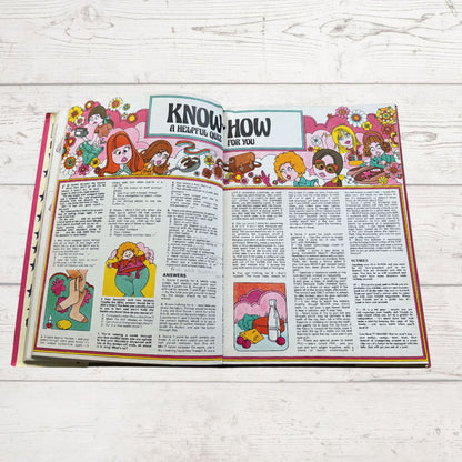Vintage Diana annual 1976 open on a white wood background 