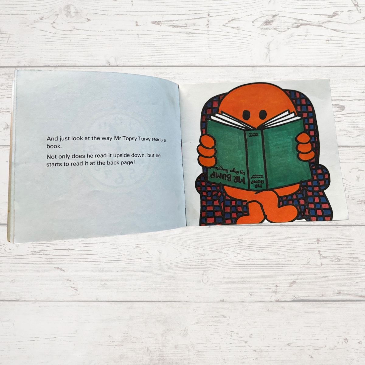Mr Topsy - Turvy Reading a book upside own 