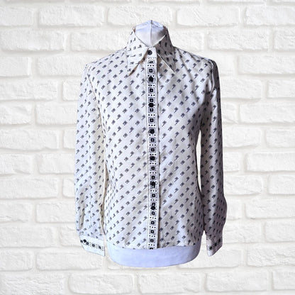 Cream and black geometric print 70s shirt on a white background 