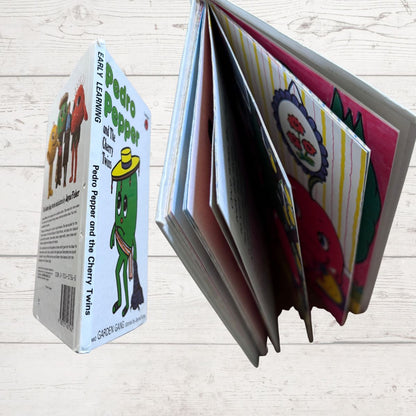 Children's book with colorful illustrations on a wooden surface