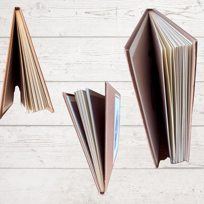 Close ups of books on a light wooden surface