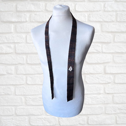 Vintage  tie on a mannequin against a white brick wall background