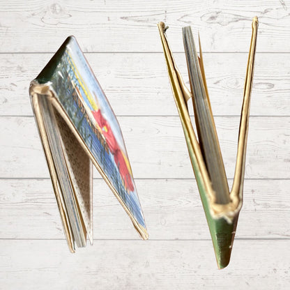 Book edges on a light wooden surface