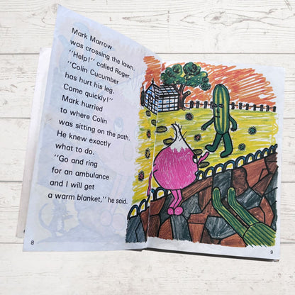Open book with illustrations and text on a wooden surface