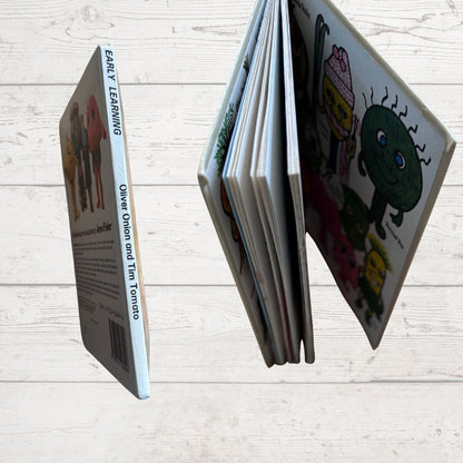 Children's book with cartoon characters on a wooden surface