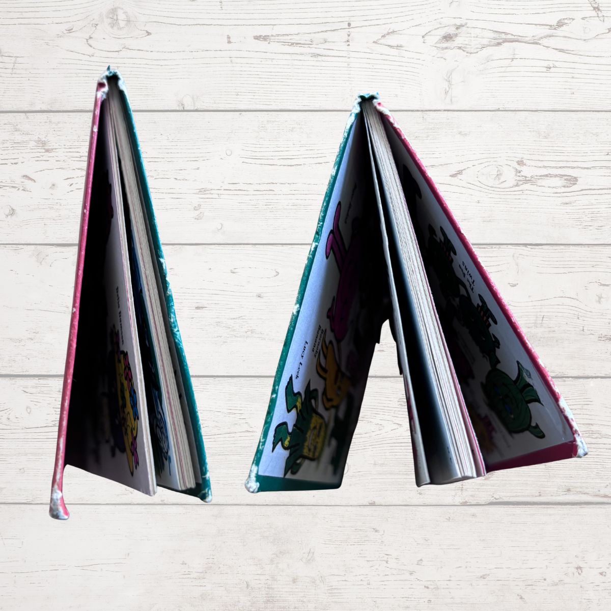 Close up of book boards  against a light wooden background