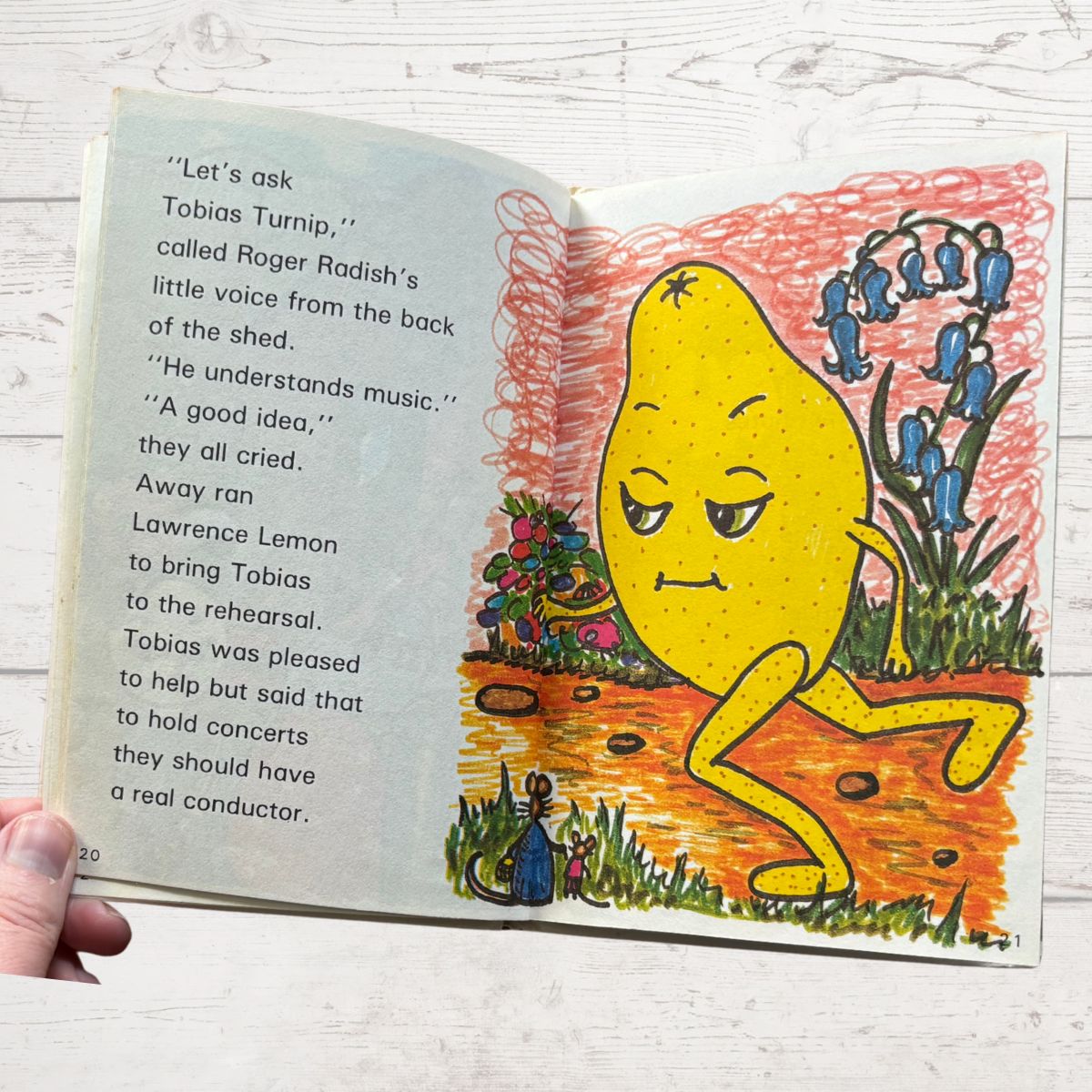 Illustrated book page with a yellow lemon character and text on a white background