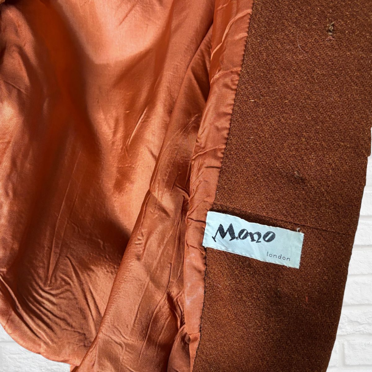 Brown fabric with a 'Mono London' label on a white background