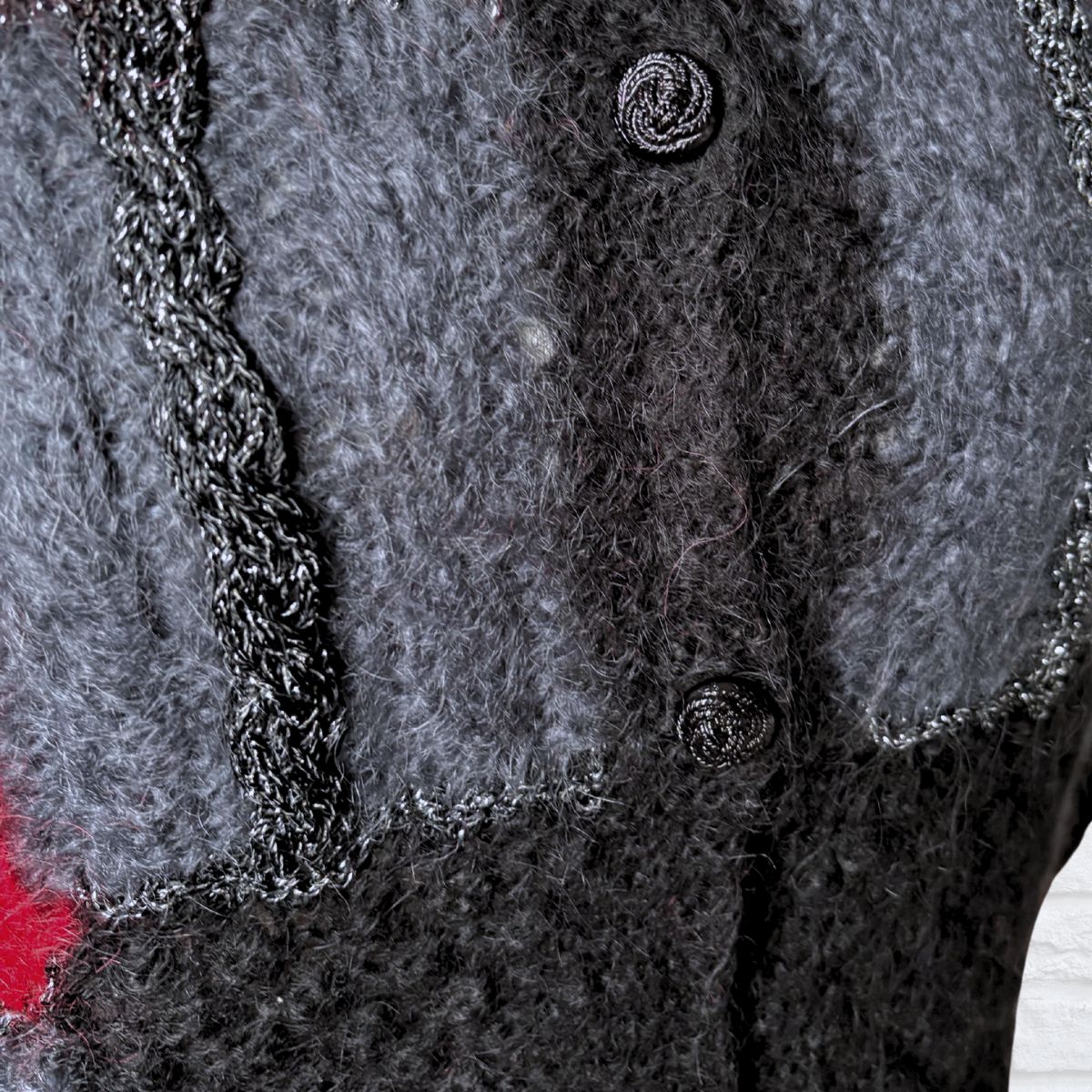 Close up black plastic rope knot  buttons 