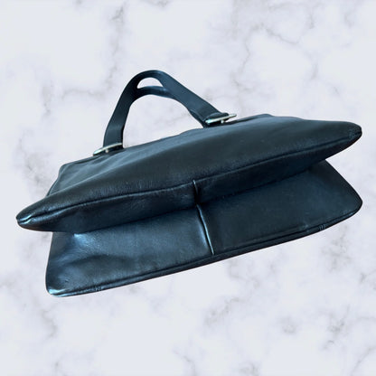 Black leather handbag on a marble surface