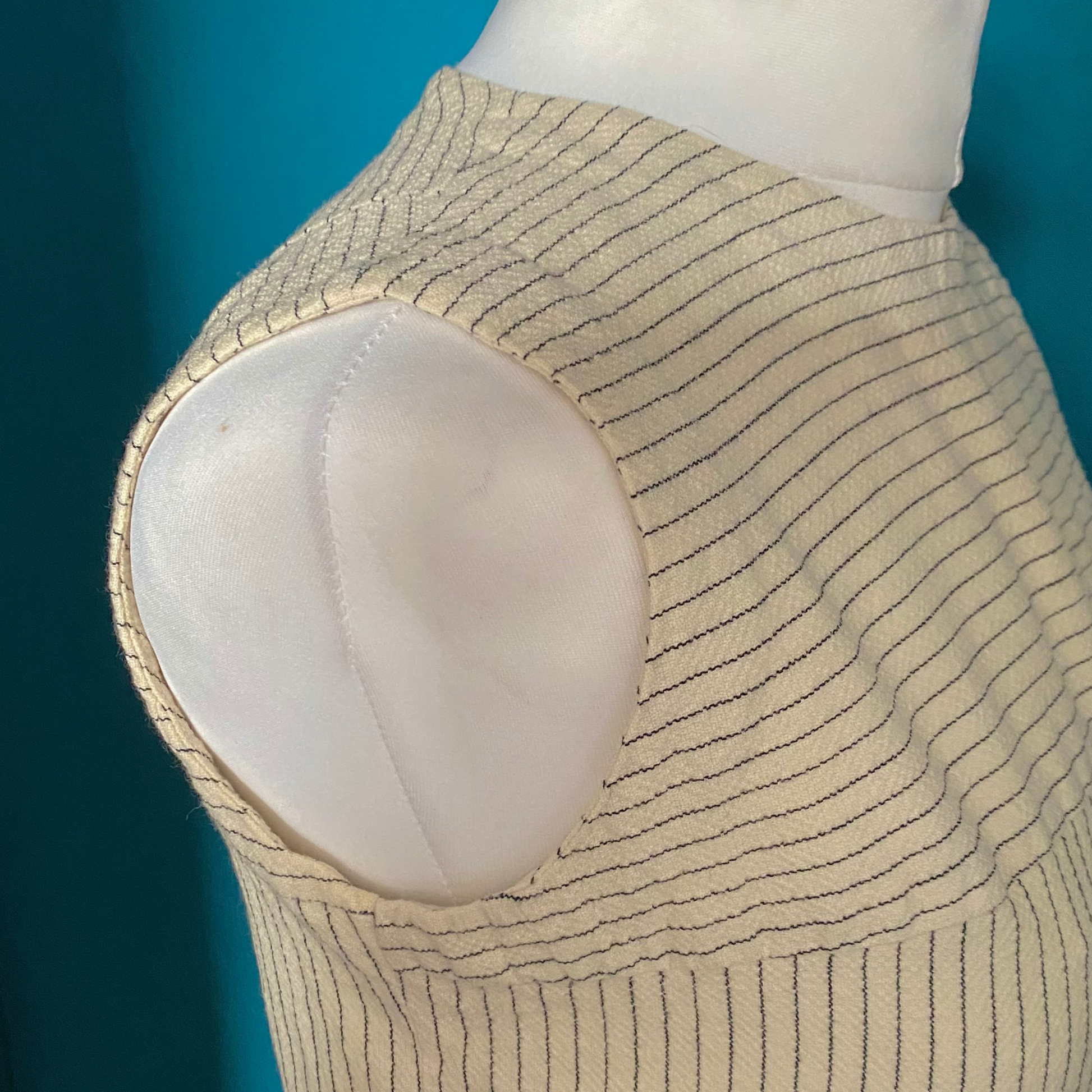 Versatile cream and black pinstripe  skirt suit - arm hole close up 