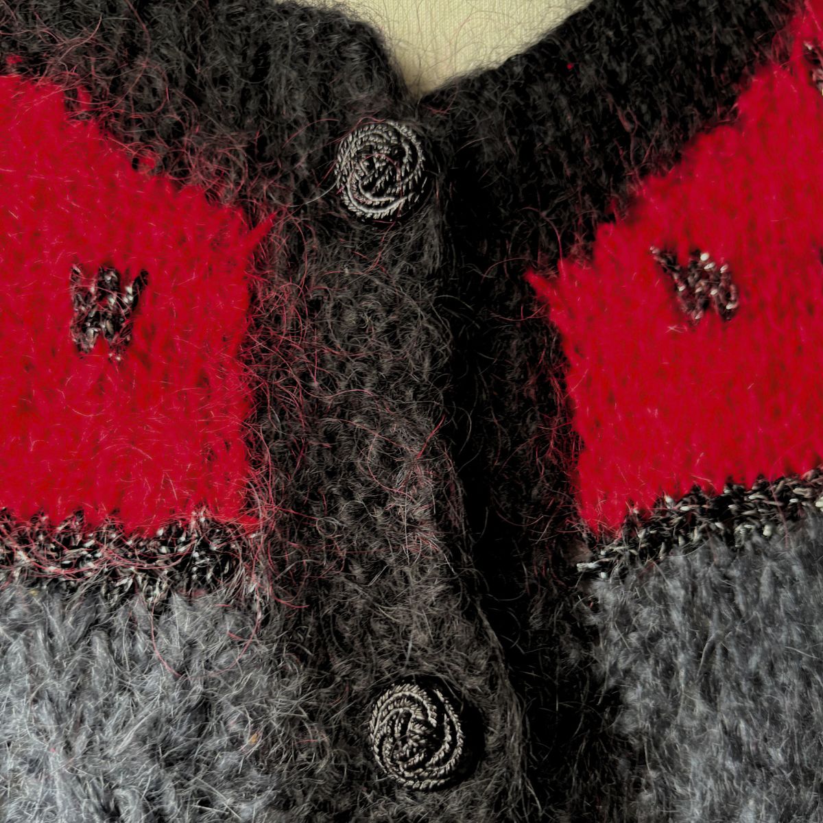 Close up black plastic rope knot  buttons 