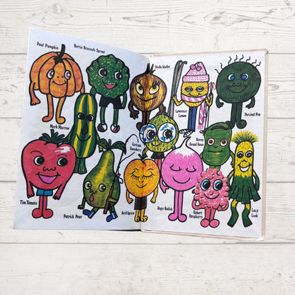 Colorful illustrations of fruit and vegetable characters on a wooden surface