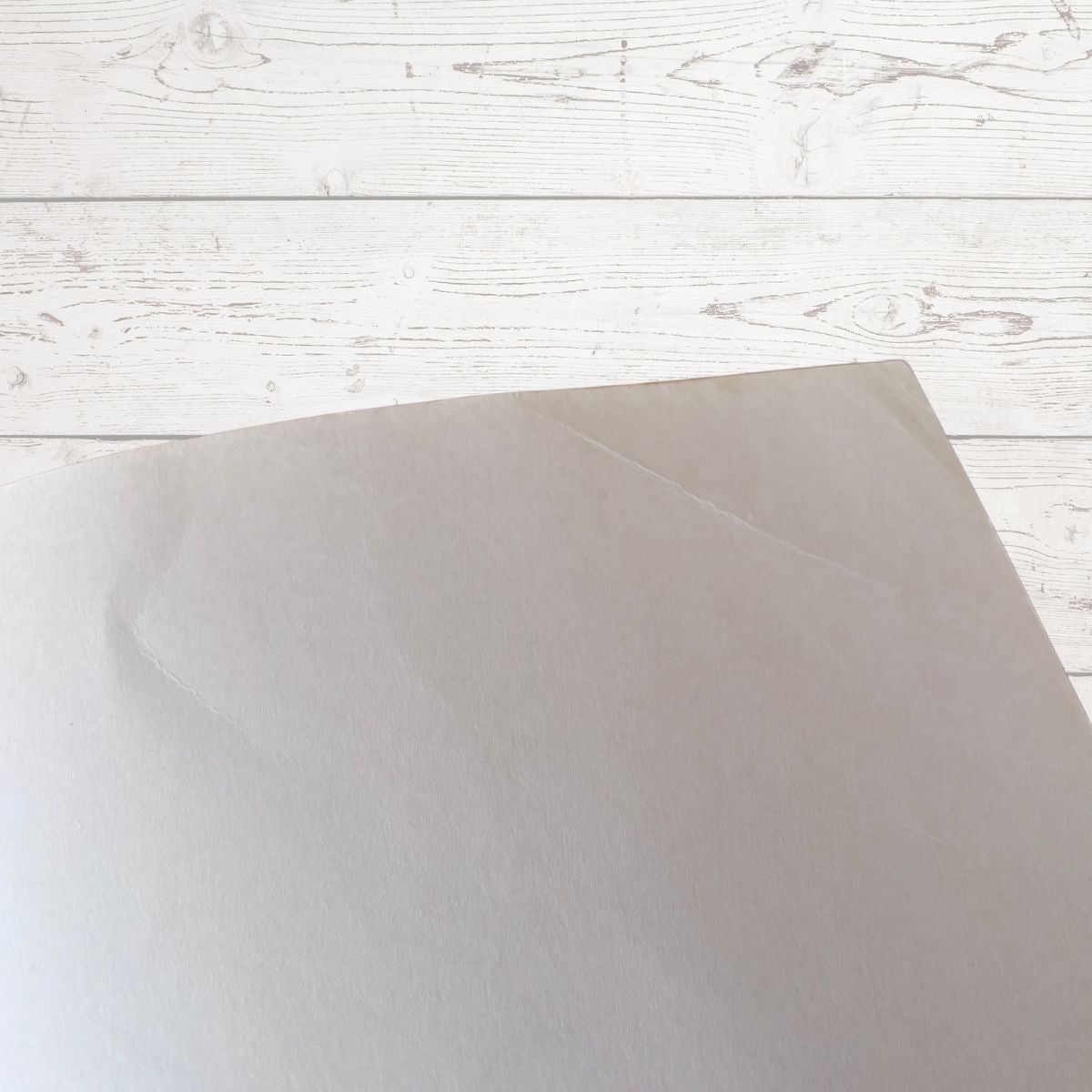 Inside book cover  on a white wooden surface