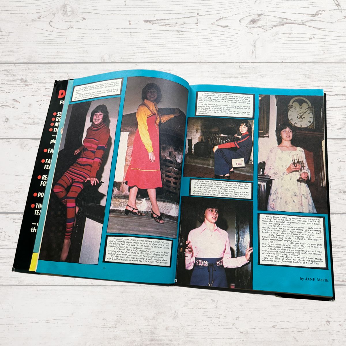 Open book with vintage fashion photos and text on a light wooden surface