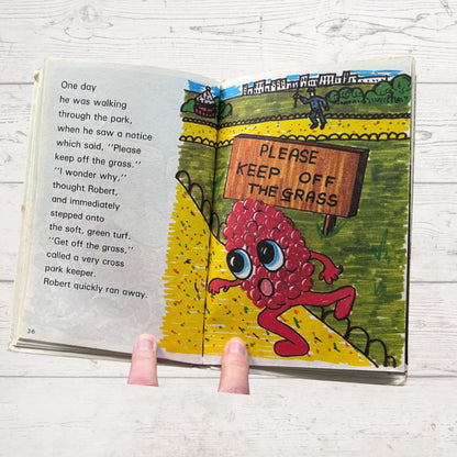 Open book with cartoon character and 'Please Keep Off the Grass' sign