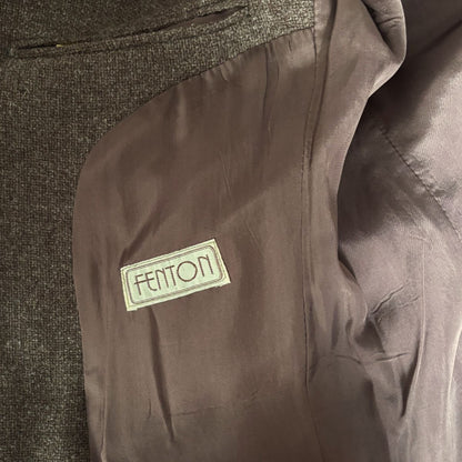 Close-up of a brown jacket with a 'Fentom' logo on the chest pocket.