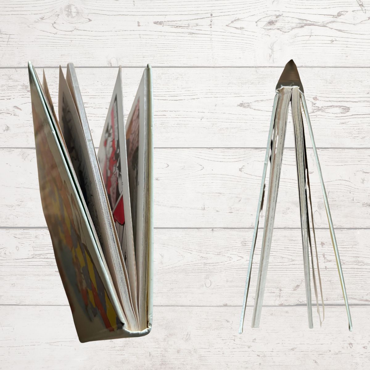 open book edges on a light wooden surface