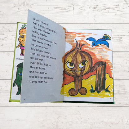 Open book with a colorful illustration of a character resembling an onion on a wooden surface