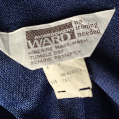 Clothing label Montgomery Ward on a blue fabric background