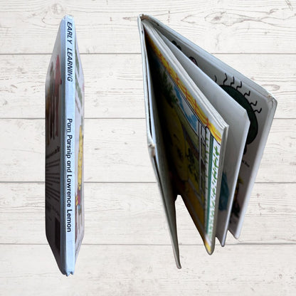  book spine  with visible pages on a light wooden surface