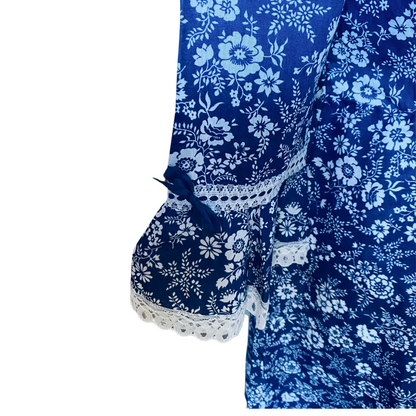 60s/70s blue and white floral mini prairie dress with white  lace trim. Approx UK. size 8-10