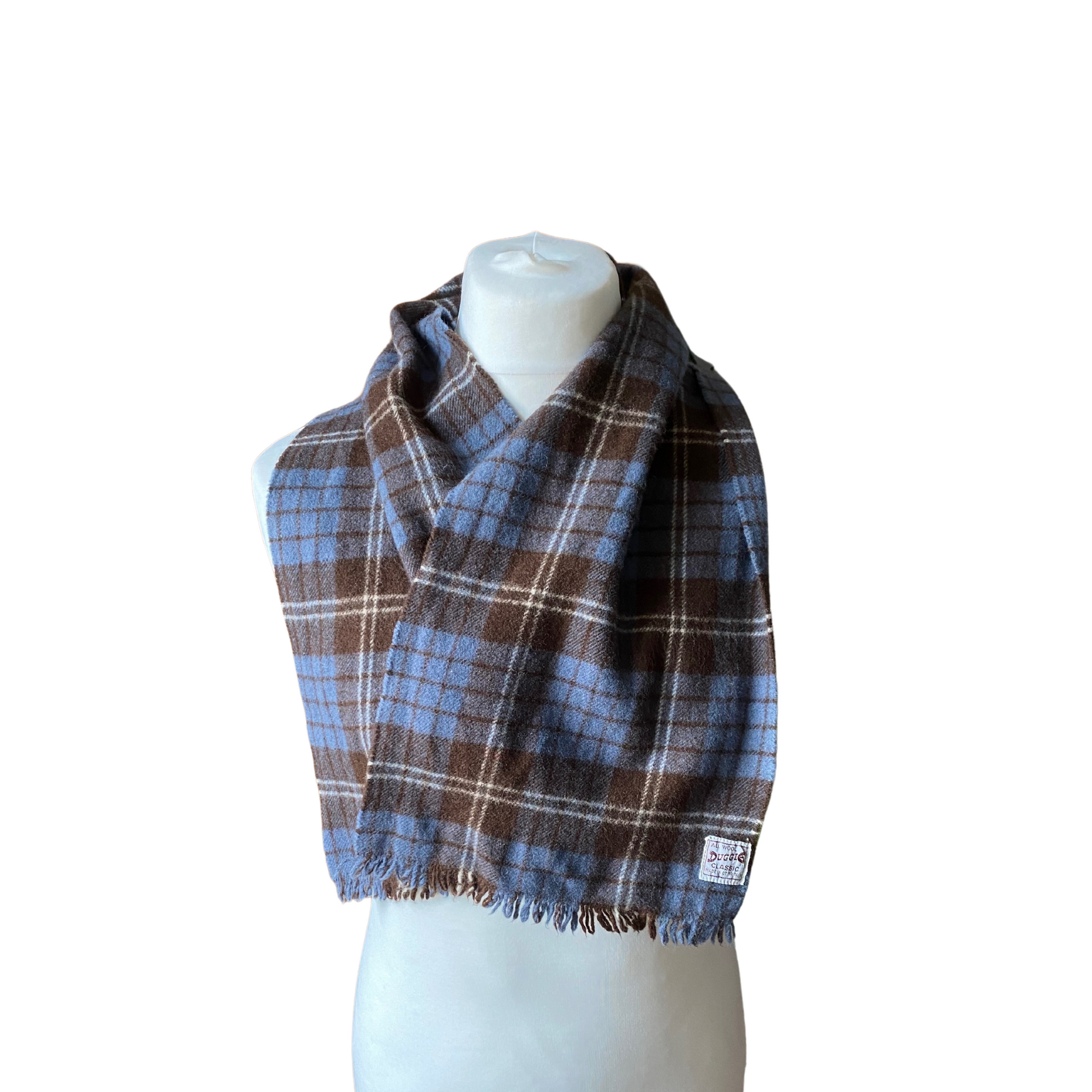 A stylish accessory for lovers of 60s mod fashion, featuring a classic tartan pattern with fringed edges.