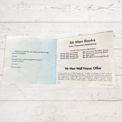 Promotional fly leaf cover  for Mr Men books from Thuman Publishing on a wooden surface