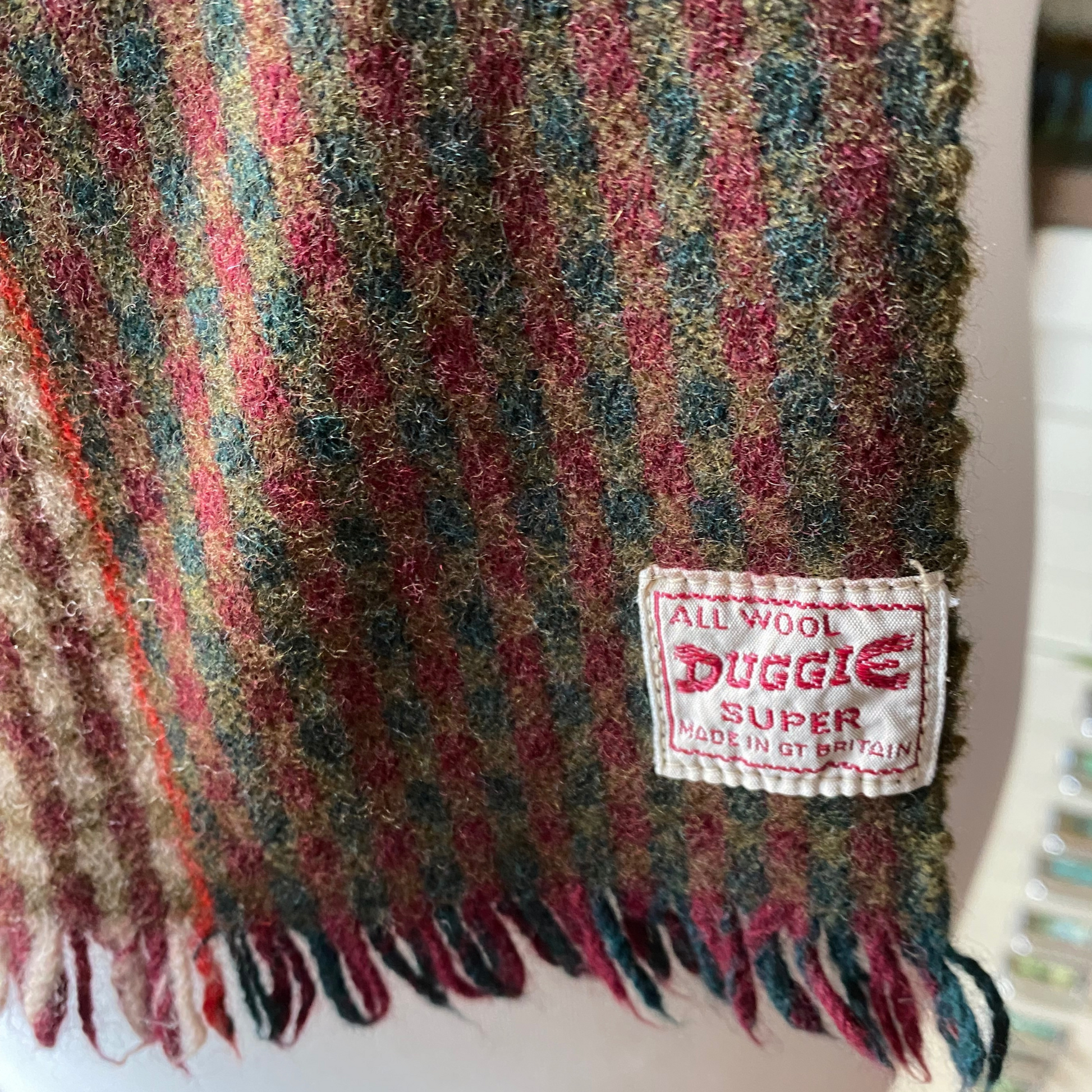 Close up of checked Duggie scarf label 