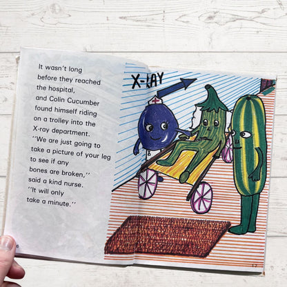 Illustrated book page with characters on a trolley heading to an X-ray department.