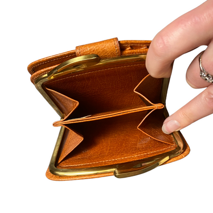 Classic tan leather purse/wallet with a secure clasp and spacious interior