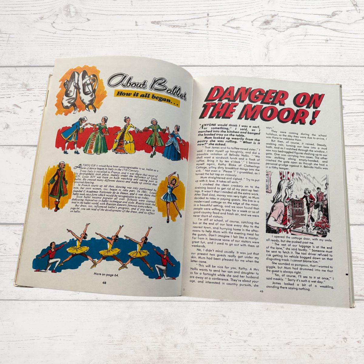 Open book with vintage illustrations and text on a wooden surface