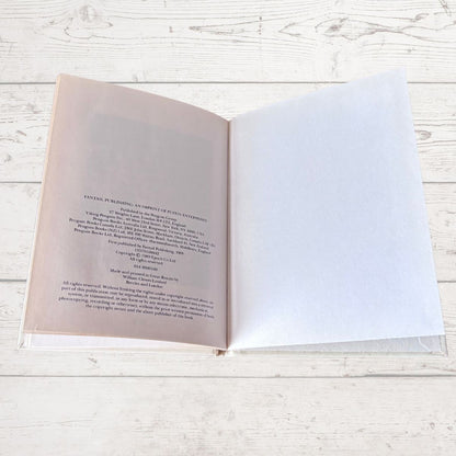 Open book with text on a wooden surface
