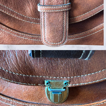 Close up of metal hardback push button clasp 