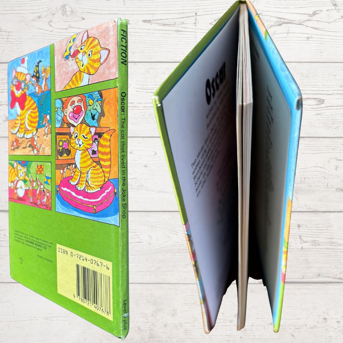 Book with colorful back cover featuring cartoon characters on a wooden surface