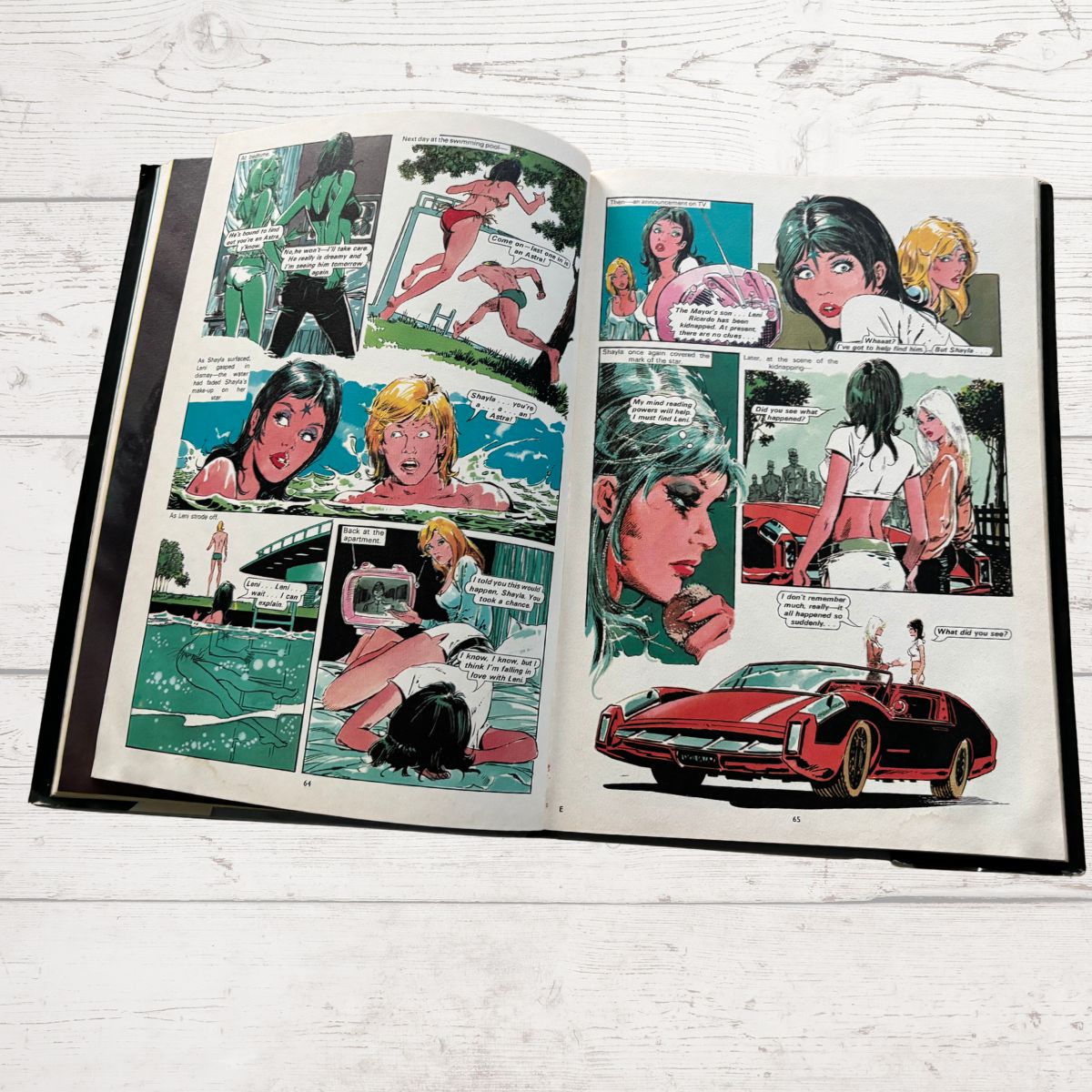 Open comic book on a wooden surface