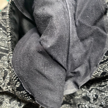 Iconic 60s black dress with silver art deco print - close up of inner underarm black lining 