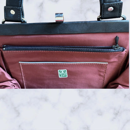 Zip up pocket in a vintage bag 