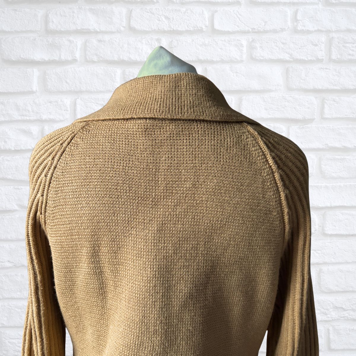 Beige collared cardigan on a white background 