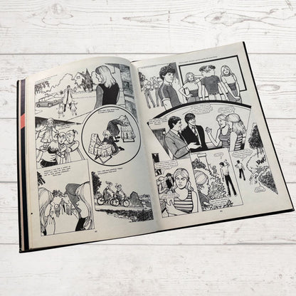 Open comic book on a wooden surface