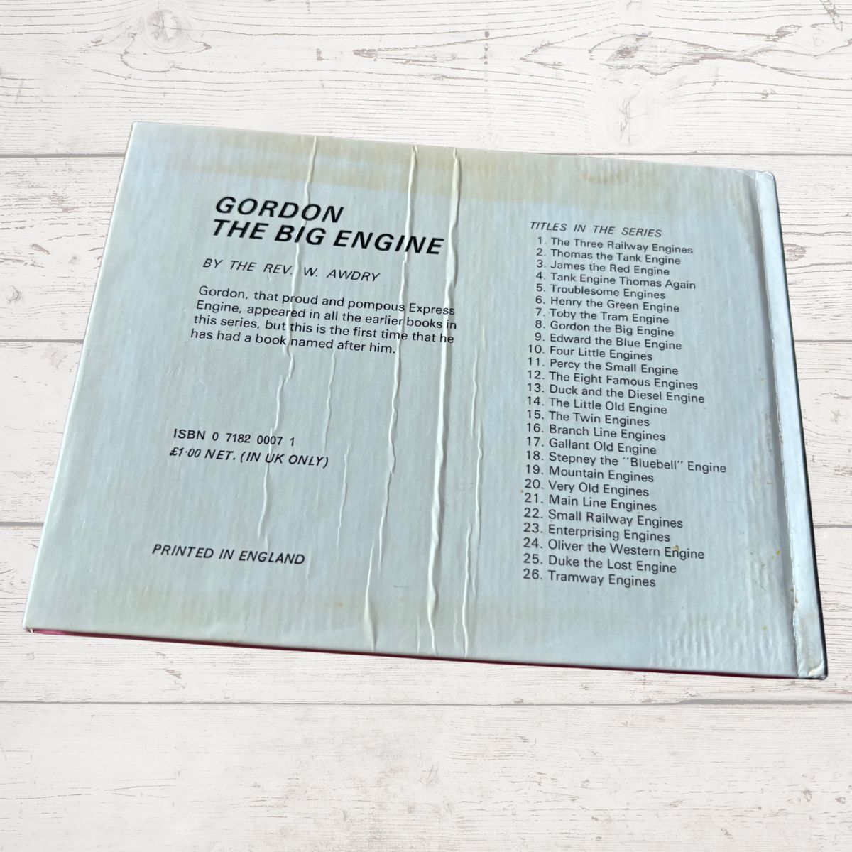 Book cover of 'Gordon the Big Engine' by Rev. W. Awdry on a light wooden surface