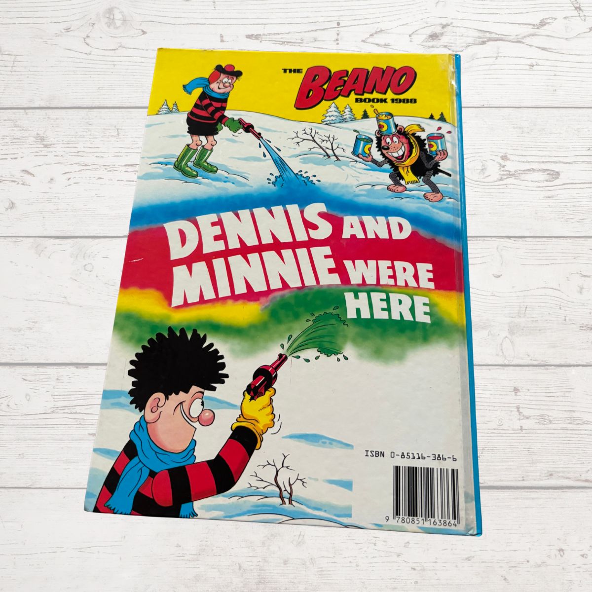 Comic book cover featuring characters from 'The Beano' with a winter scene.