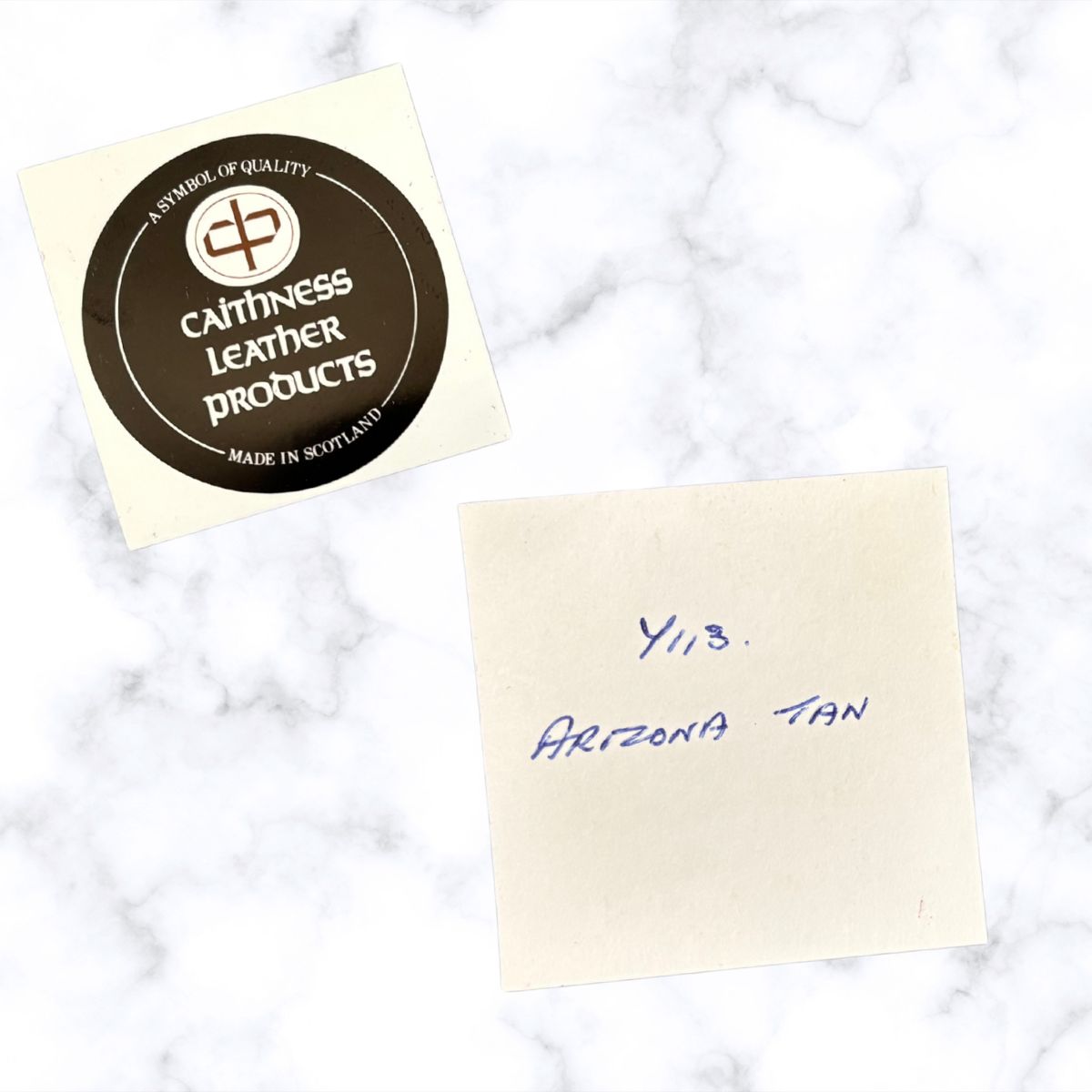 Cathness Leather Products label on a marble surface