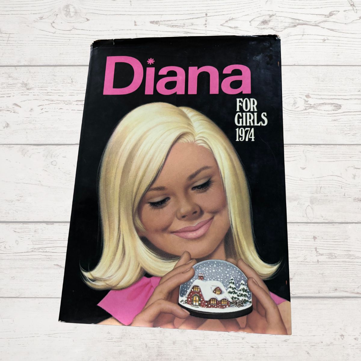 vintage Diana Annual 1974 on a white wood background 