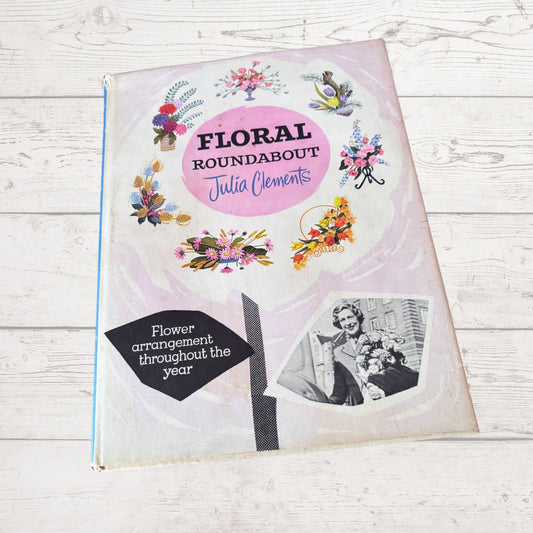 Book titled 'Floral Roundabout' by Julia Clements on a wooden surface