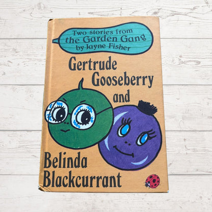 Book cover of 'Gertrude Gooseberry and Belinda Blackcurrant' by Jayne Fisher on a wooden surface.