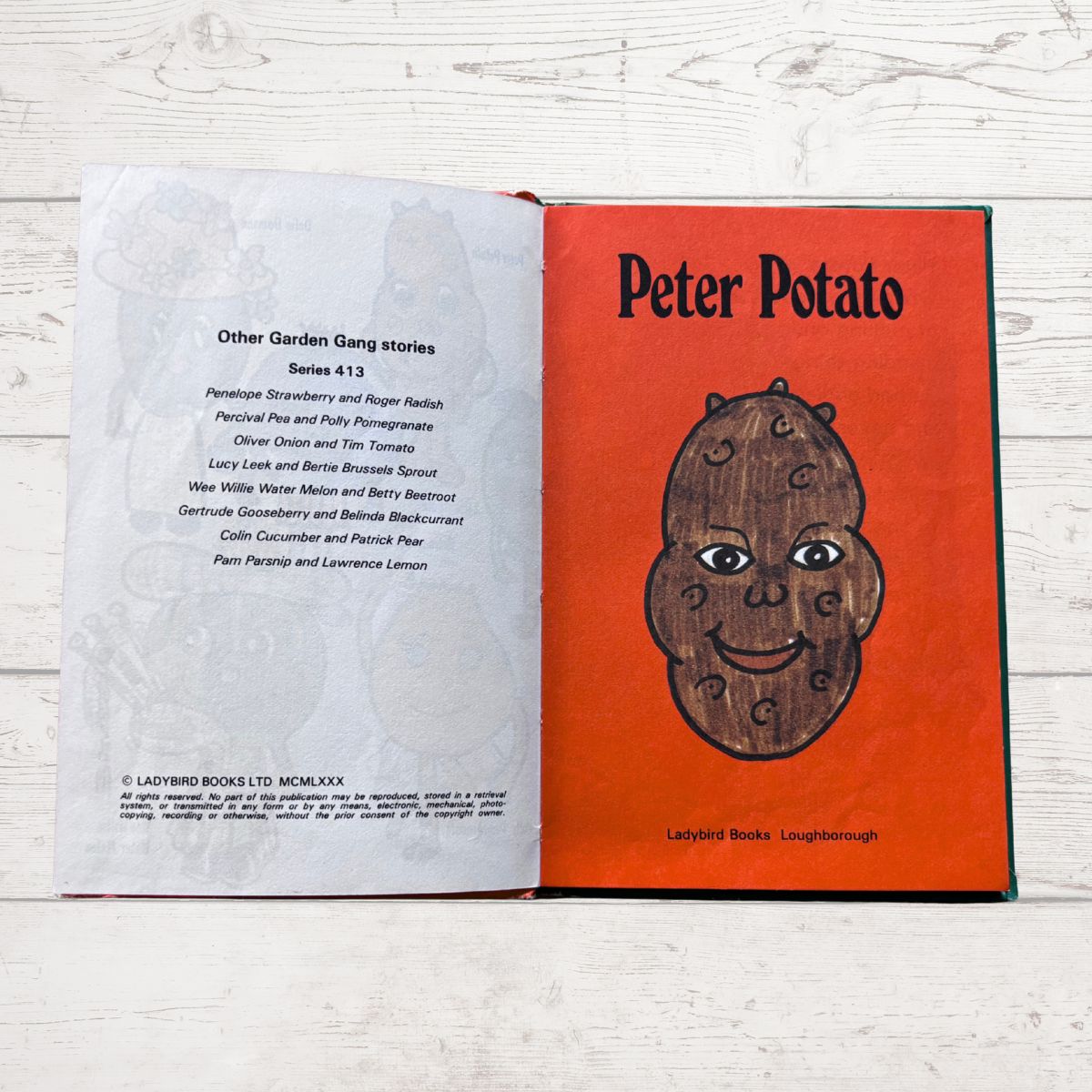 Open book with 'Peter Potato' on the cover and text on the left page.