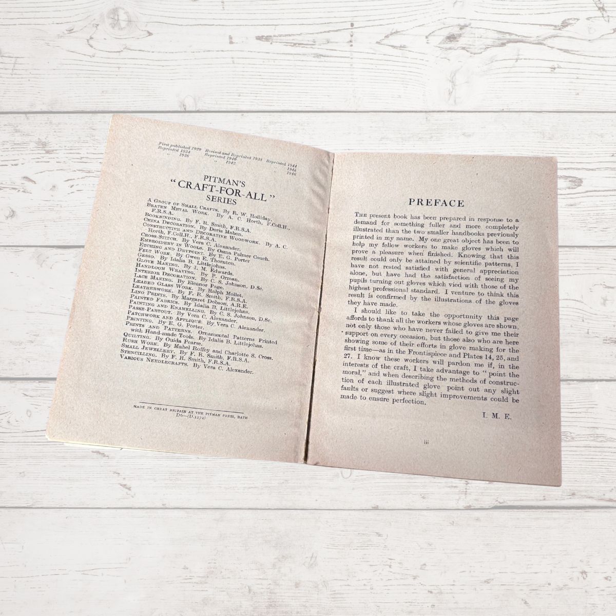 Open book on a wooden surface with visible text