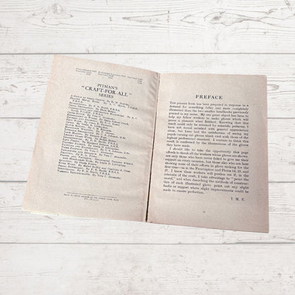 Open book on a wooden surface with visible text